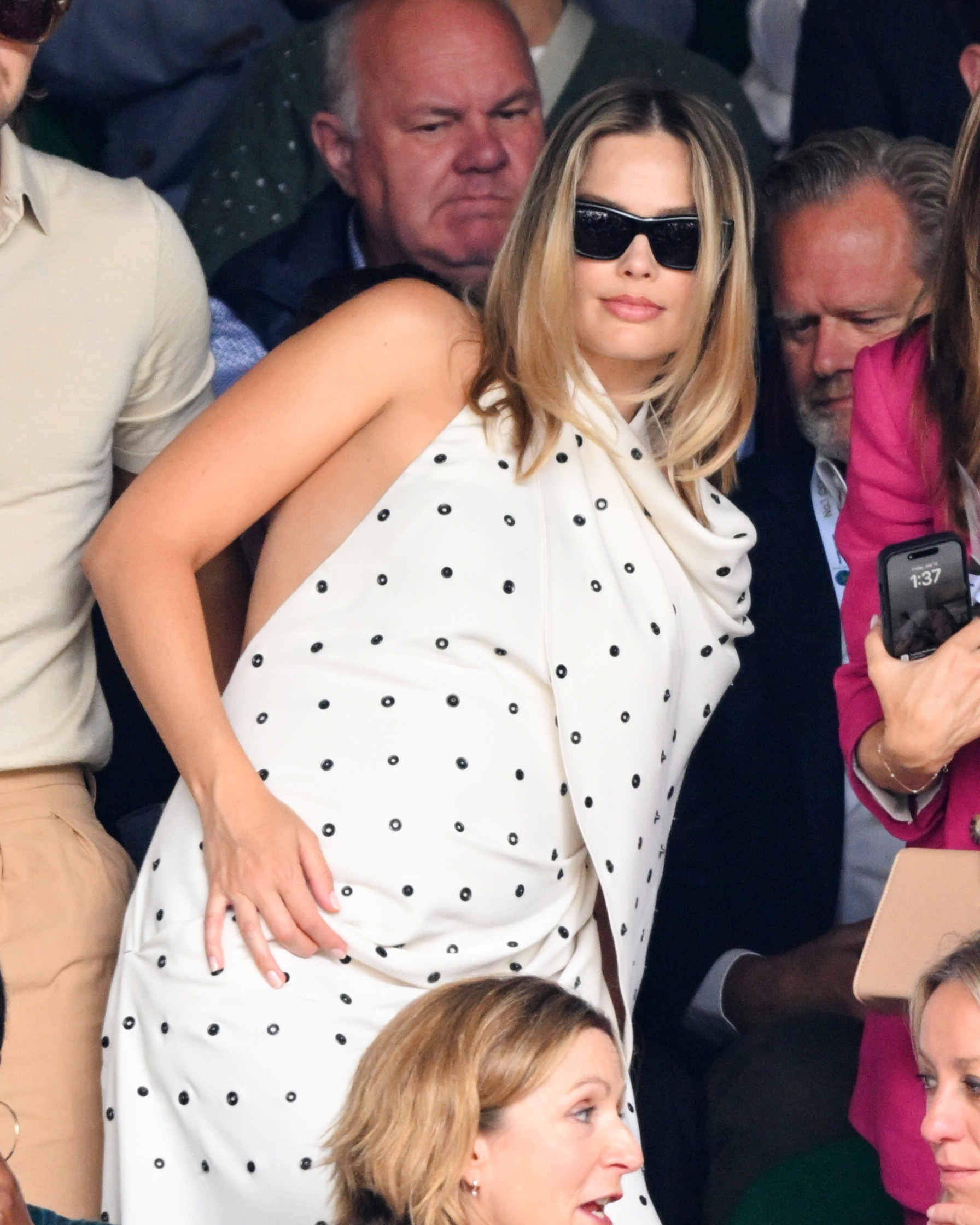 The actress put her blossoming bump on display at the sporting event