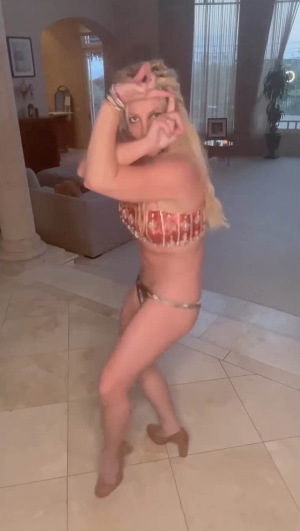 Britney wore her bikini bottoms dangerously low while dancing to Madonna's I'm Addicted