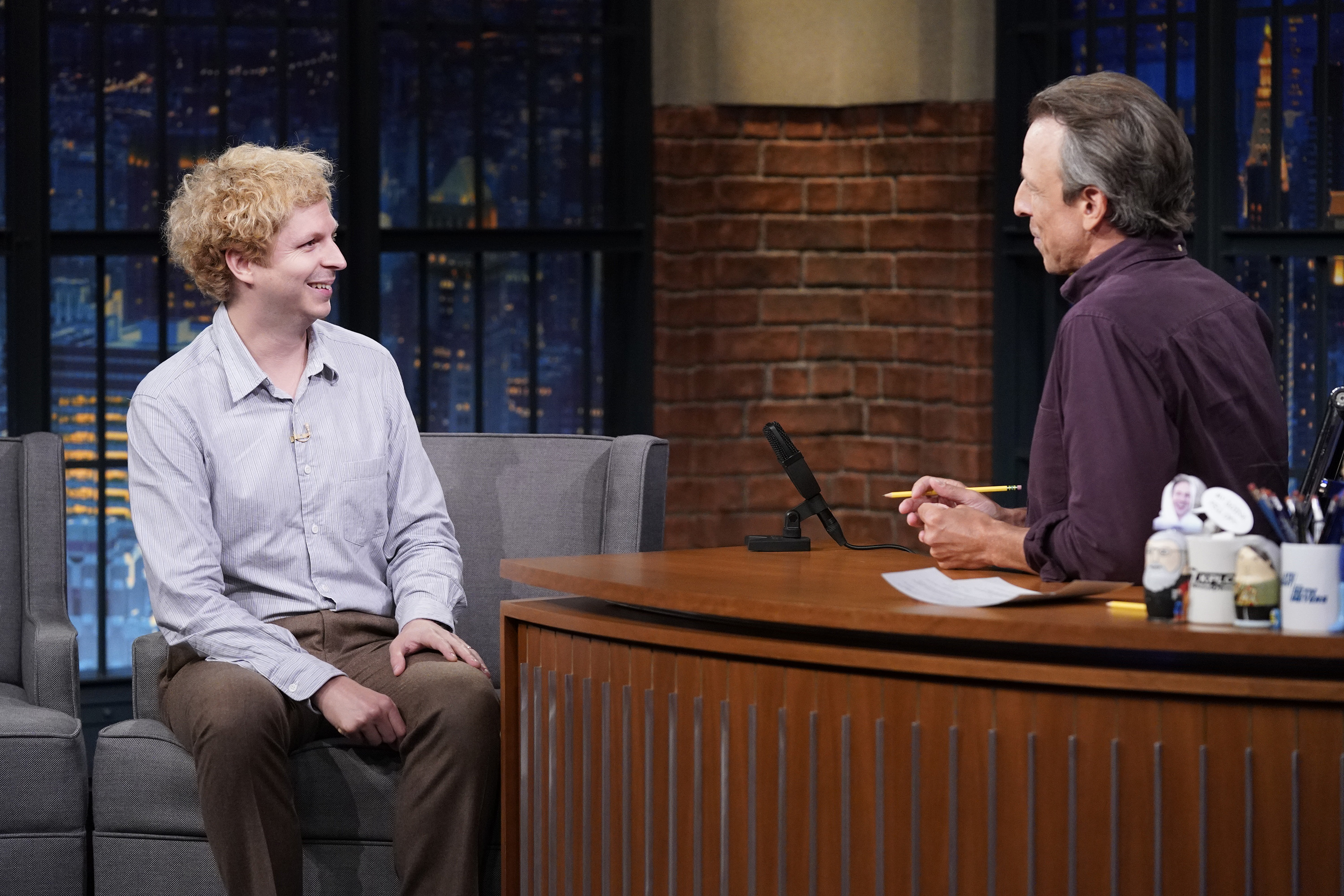 Michael Cera talking with Seth Meyers during his appearance on Late Night with Seth Meyers