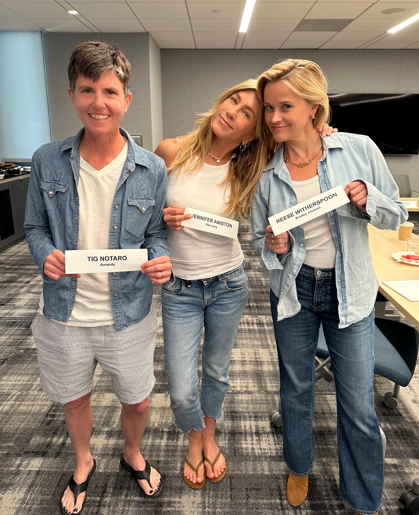 Jennifer Aniston, Tig Notaro, and Reese Witherspoon displaying the The Morning Show Season 4 script