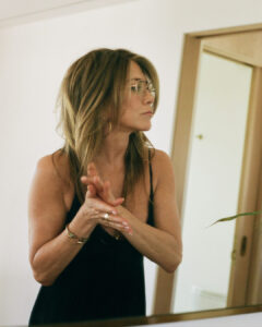 Jennifer Aniston went braless in a low-cut tank top in a new LolaVie ad