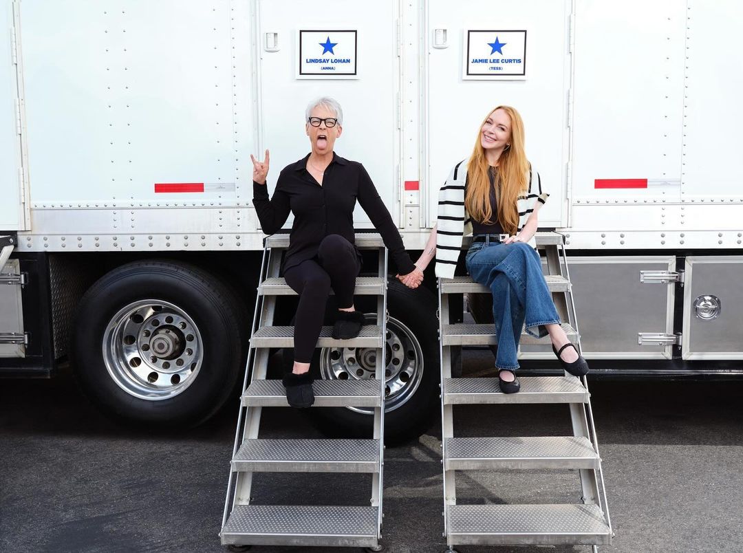Jamie Lee Curtis and Lindsay Lohan, seen in front of their Freaky Friday 2 trailers, have been open about their close-knit bond