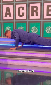 Wheel of Fortune host Ryan Seacrest showed off his physical fitness, doing different kinds of pushups as Vanna White (not pictured) and the crew laughed