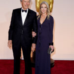 Director Clint Eastwood and Christina Sandera at the 87th Annual Academy Awards in 2015