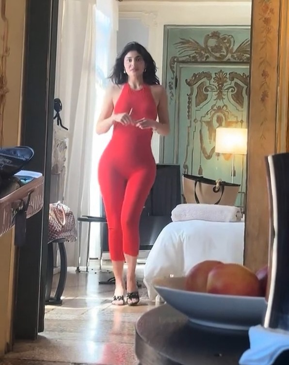 Kylie Jenner showing off her bright red bodysuit after an outfit change in Venice