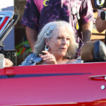 Jamie Lee Curtis sitting in a red Corvette on the set of Freak Friday 2