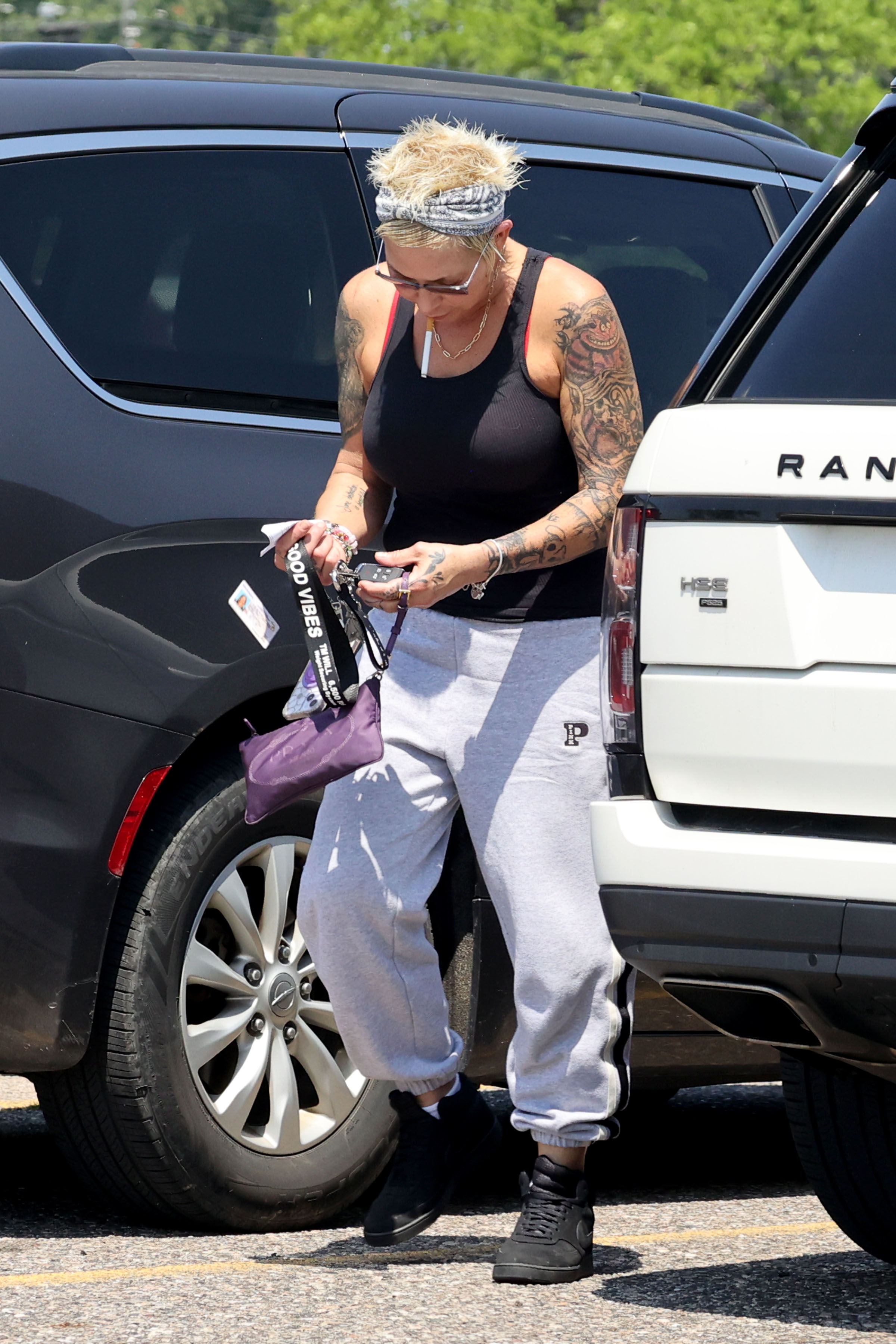 Eminem's ex-wife put a cigarette in her mouth as she stepped out of her car
