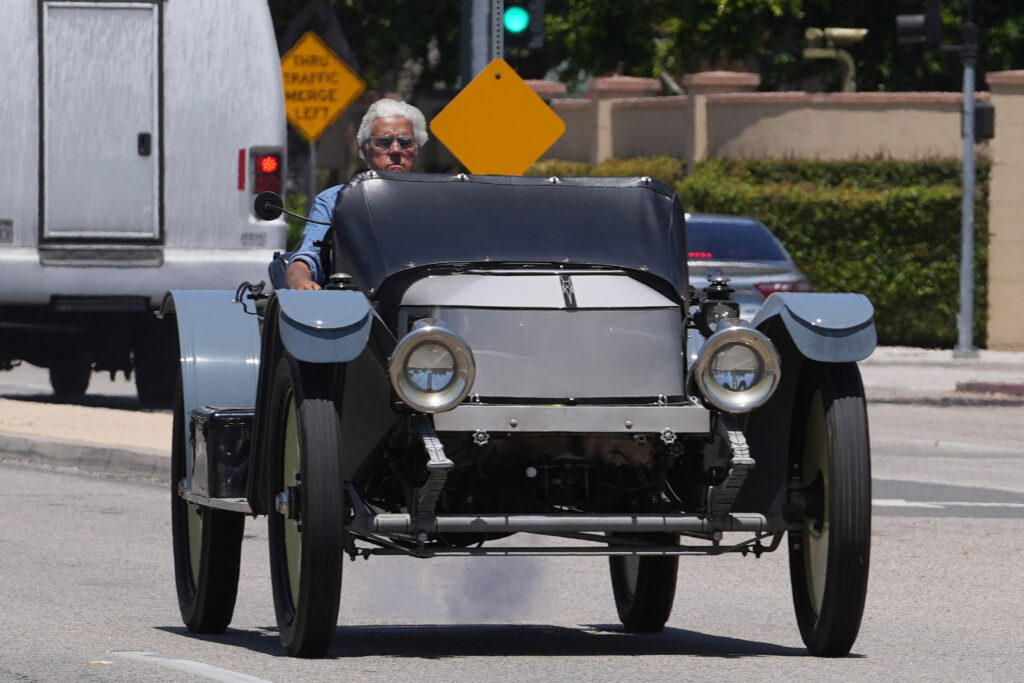Jay Leno was seen driving an early 1900s Stanley Roadster in Los Angeles on July 16, rocking a denim shirt and serious expression on his face