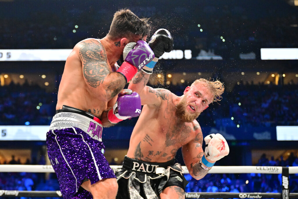TAMPA, FLORIDA – JULY 20: Jake Paul punches Mike Perry during their cruiserweight fight at Amalie Arena on July 20, 2024 in Tampa, Florida. (Photo by Julio Aguilar/Getty Images)