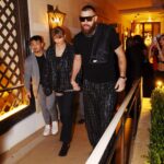 Taylor Swift and Travis Kelce walking hand-in-hand