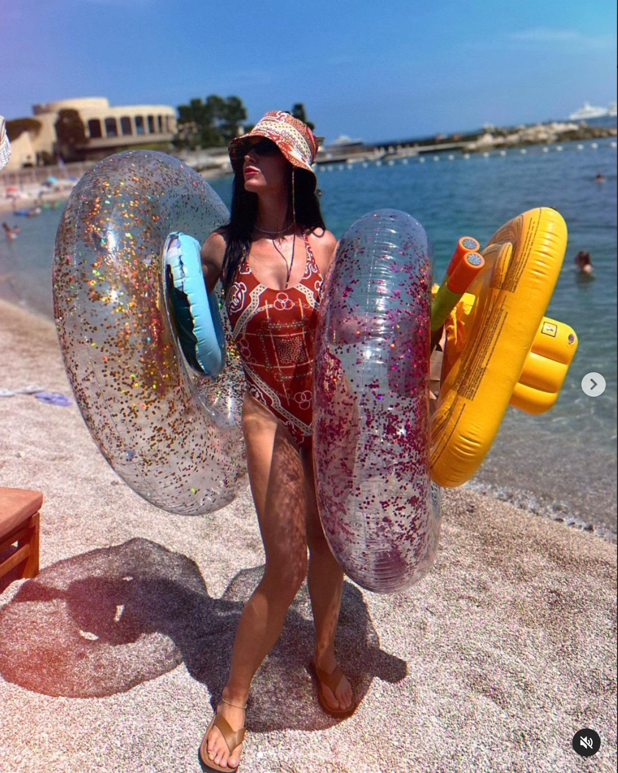 Katy Perry sporting a swimsuit on the beach during a family getaway