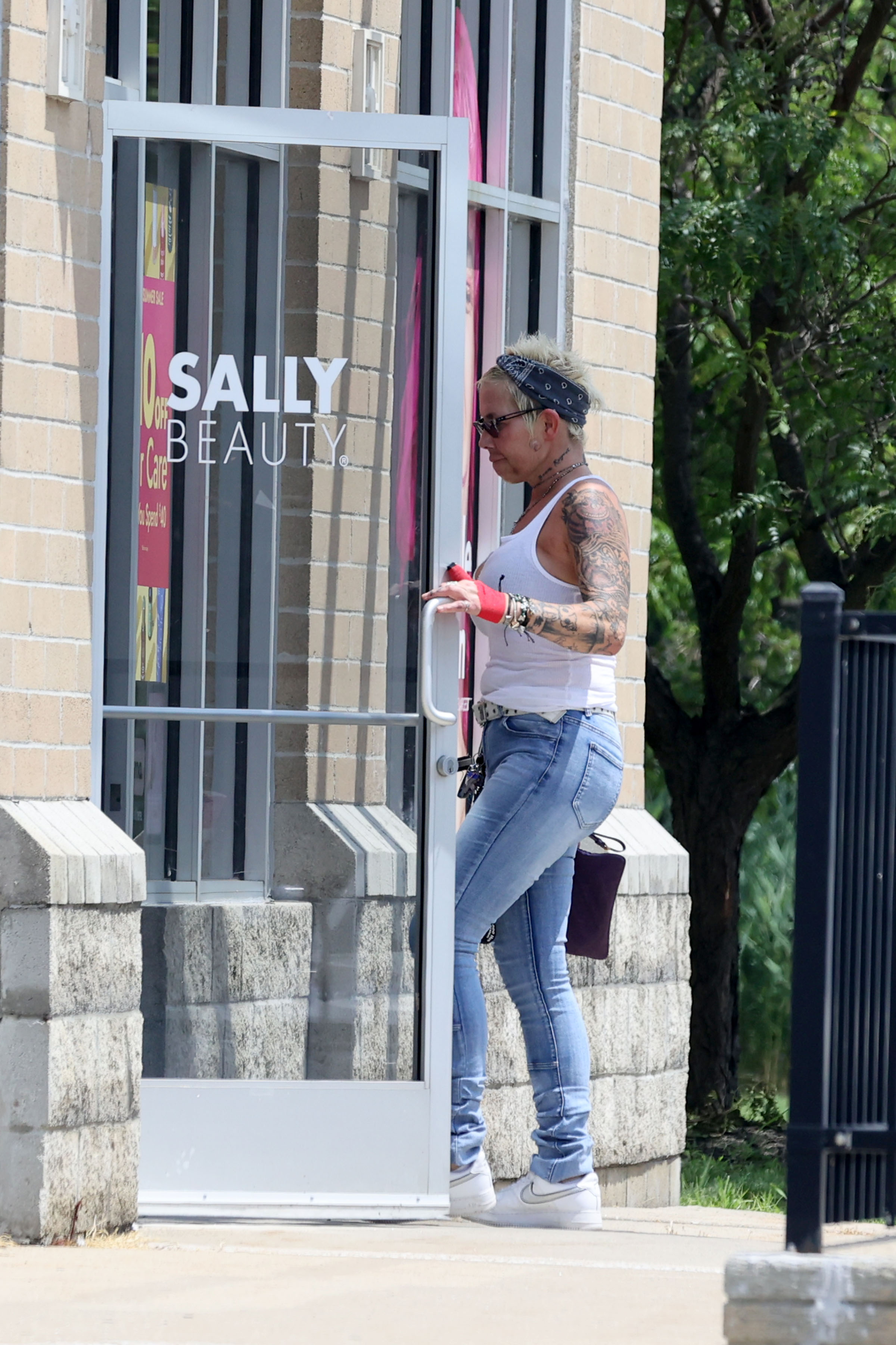 Eminem's ex-wife Kim headed into a Sally Beauty store wearing a white tank top and jeans