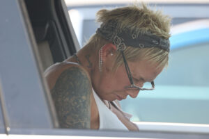 Kim Mathers is seen catching forty winks on a day out shopping in Michigan