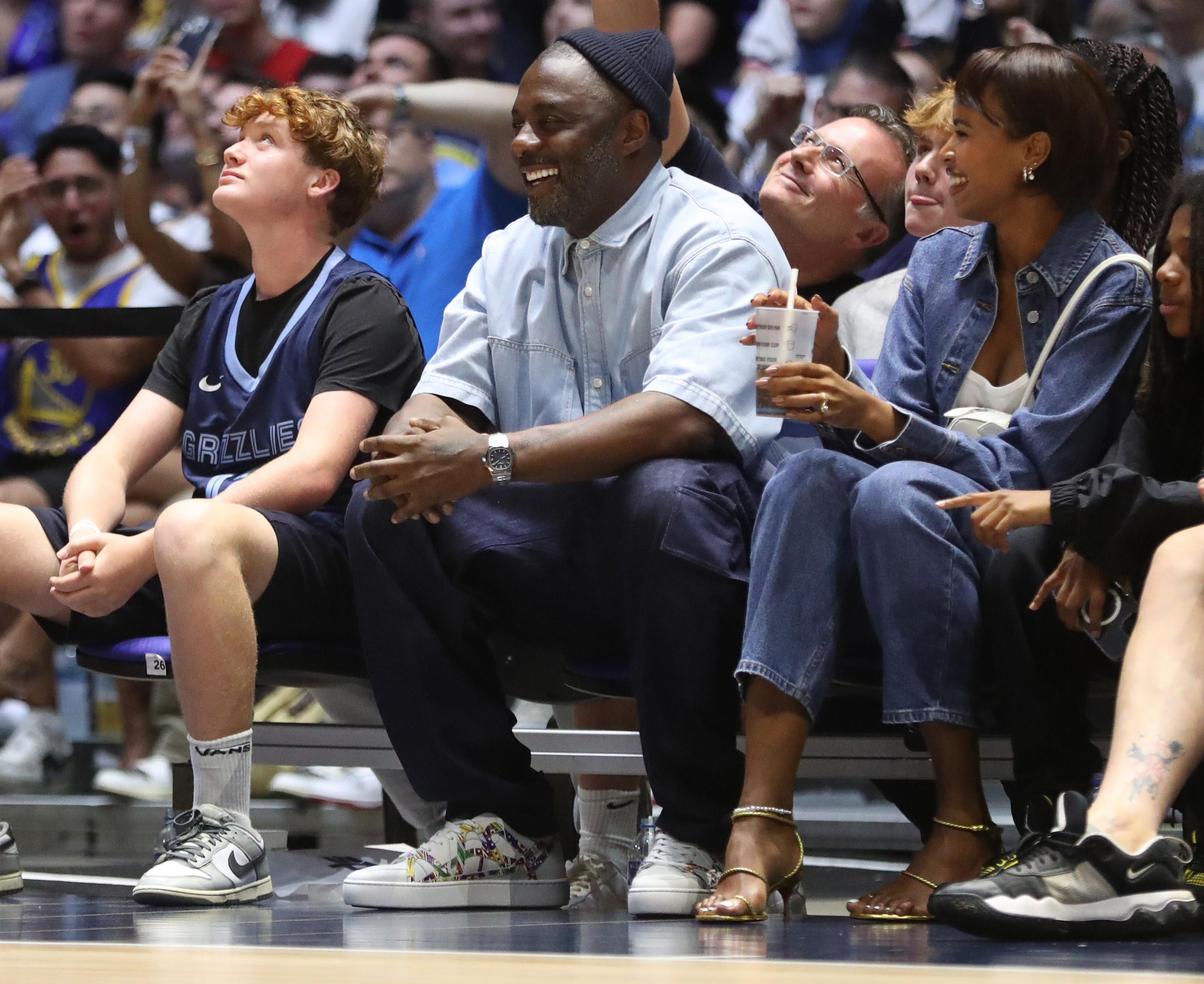Actor Idris Elba laughs during the USA Basketball Showcase