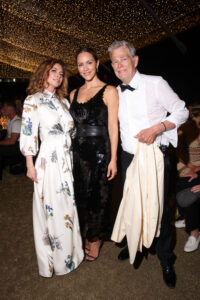 Shania Twain, with Katharine McPhee, and David Foster, at The Fab Thirties Event on July 21, 2024, in Italy, wore a modest white dress with flowers
