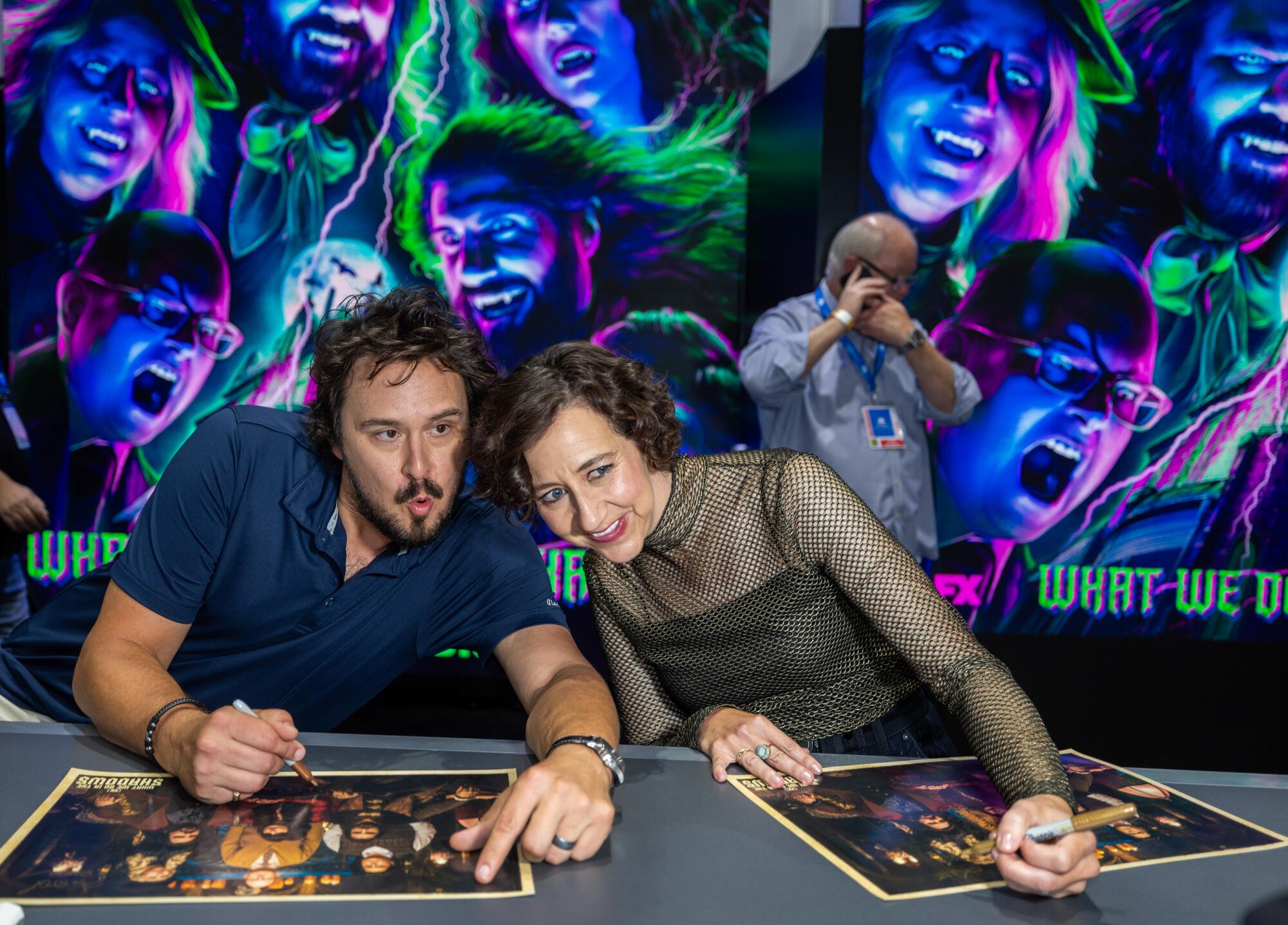 Actor Kristen Schaal, right, as "the guide", poses for a photo with Kyle Newacheck.