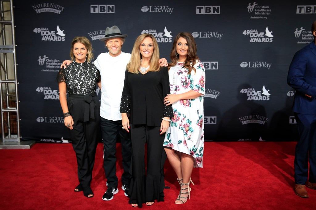 The Nelons, including Kelly Nelon Clark, posing on the red carpet at the 49th Annual Dove Awards in Nashville, TN