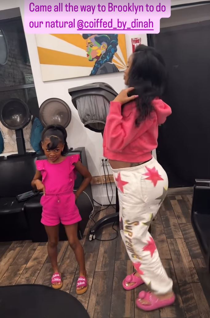 Cardi B wearing a cropped sweater and sweatpants during a trip to the hair salon with her daughter, Kulture