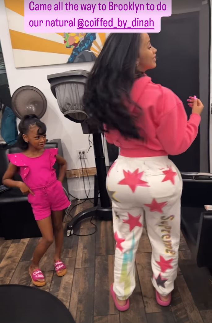 Cardi B and her daughter Kulture showing off their matching pink outfits in a video