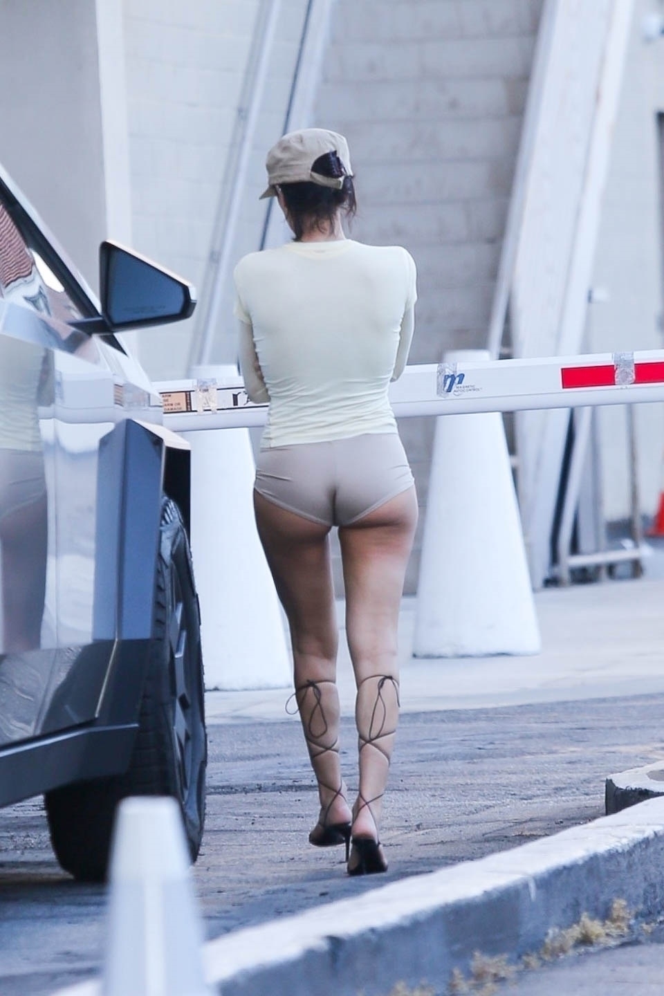 Bianca Censori wearing a long-sleeved shirt and underwear while heading into a movie theater in Los Angeles, California