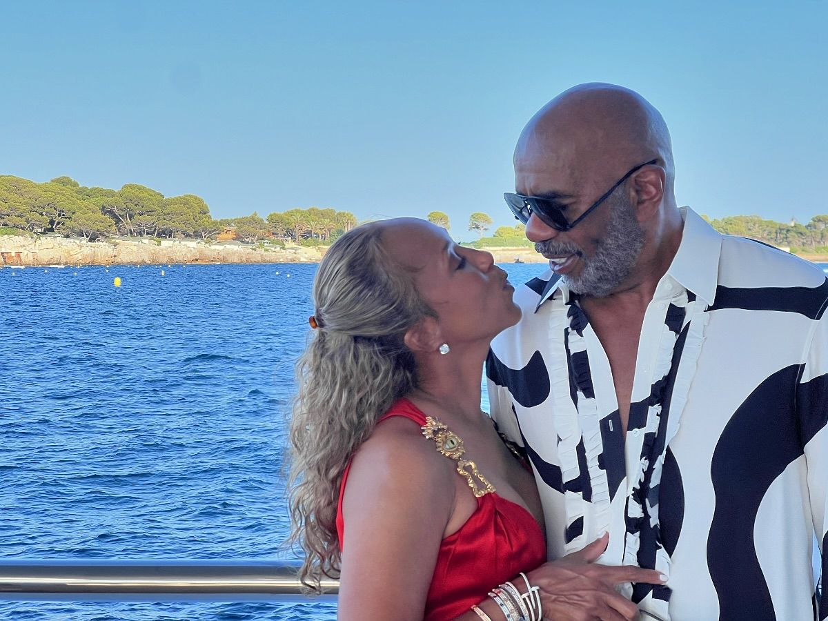 Steve and Marjorie Harvey shared a kiss while on a boat last week