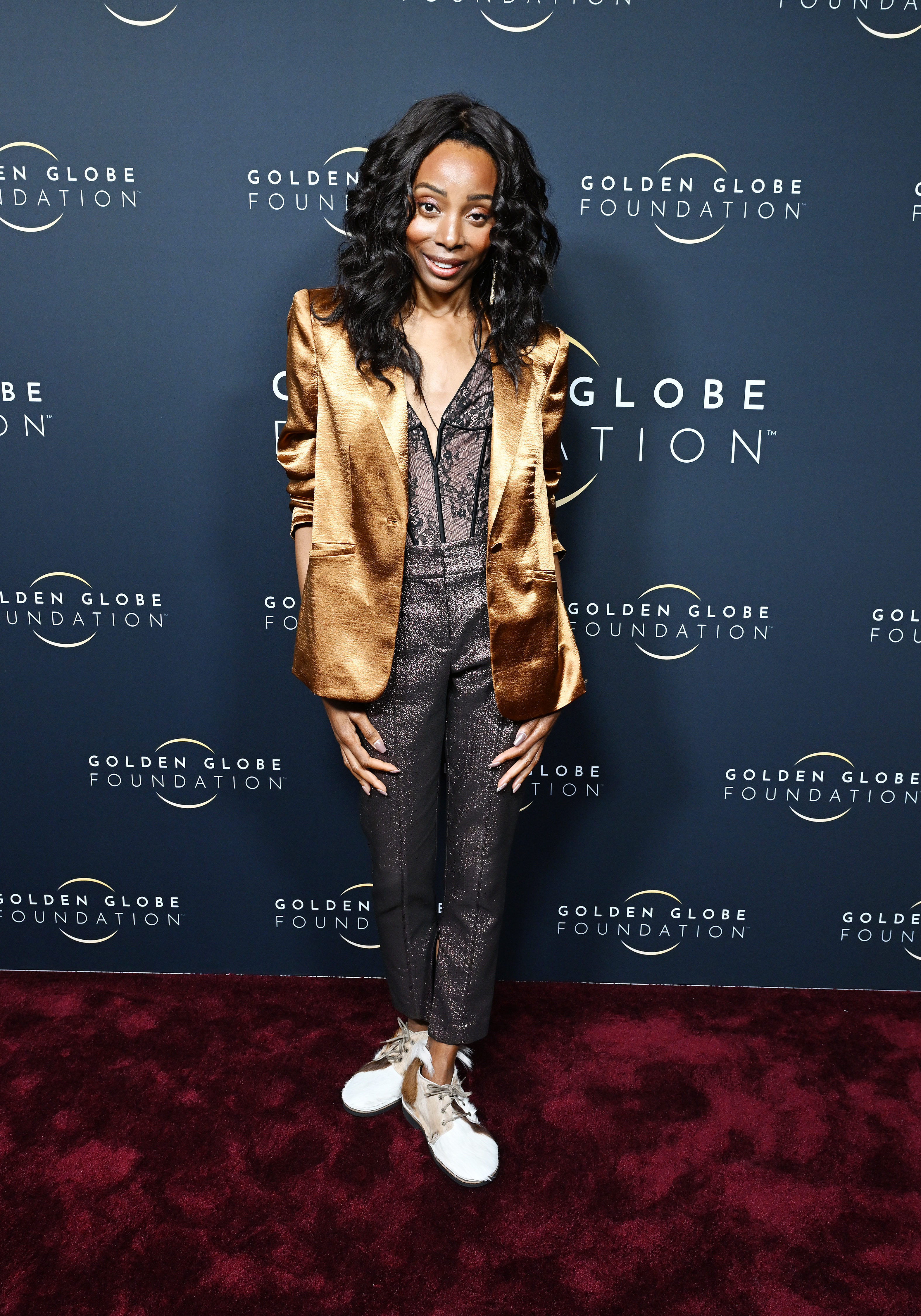 Erica Ash rocks a lace bodysuit and gold blazer at the Golden Globe Foundation Dinner in Beverly Hills, California in January