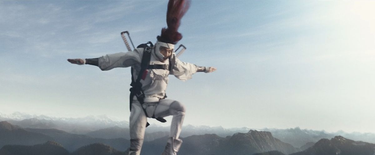 Shatterstar (Lewis Tan) leaps from a plane in a blur of motion during an action scene in Deadpool 2