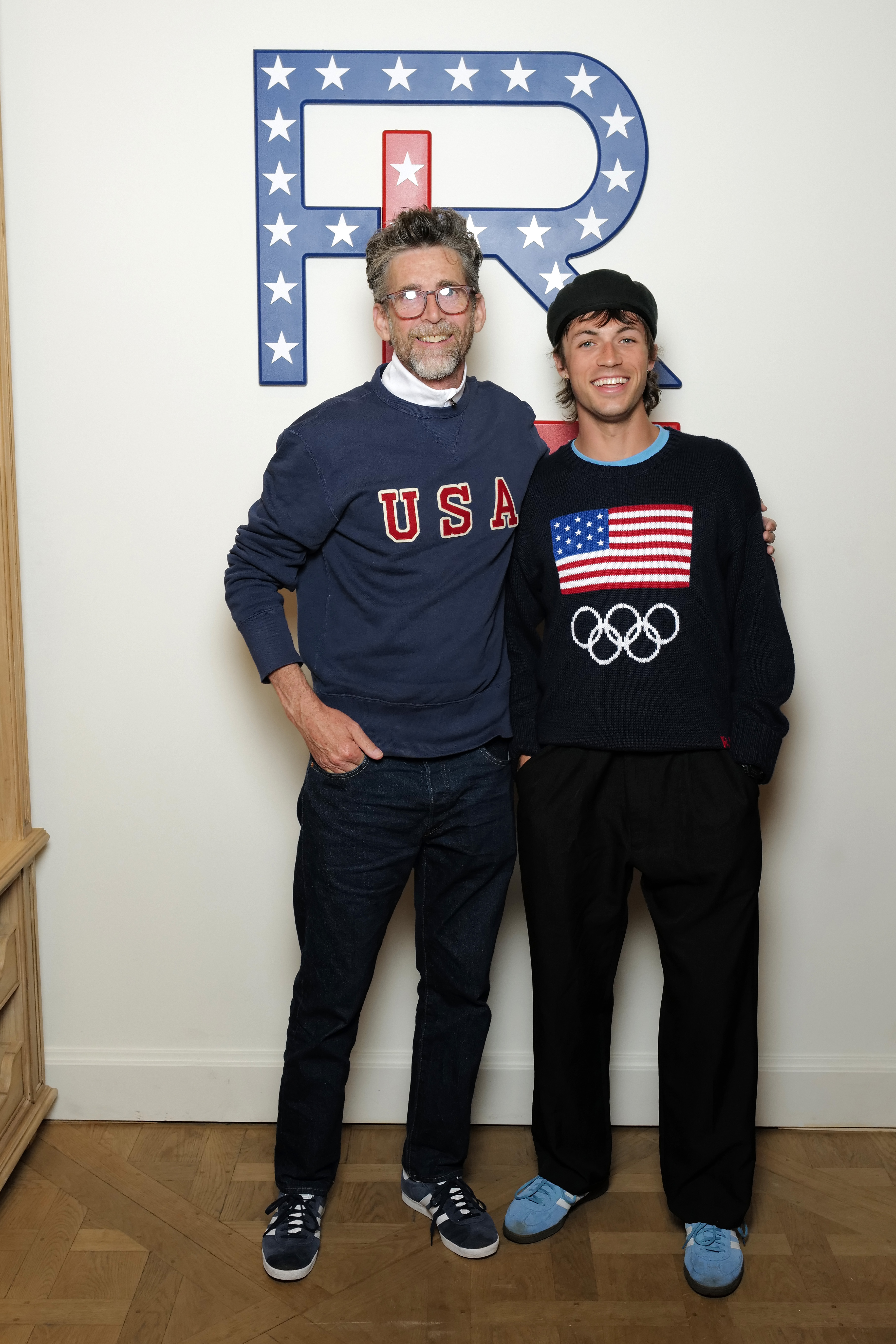 Mike Chamberlain and Peter McPoland attend the Ralph Lauren Team USA celebration on July 27, 2024 in Paris, France, with Emma Chamberlain (not pictured)