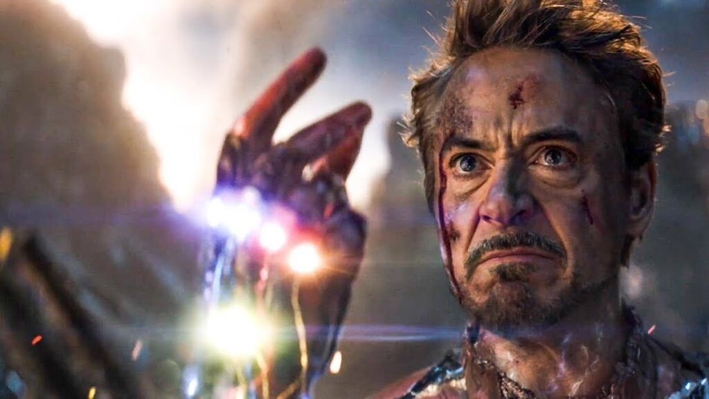 A battered Tony Stark in his Iron Man suit snaps the Infinity Stones in Avengers: Endgame