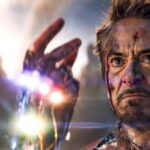 A battered Tony Stark in his Iron Man suit snaps the Infinity Stones in Avengers: Endgame