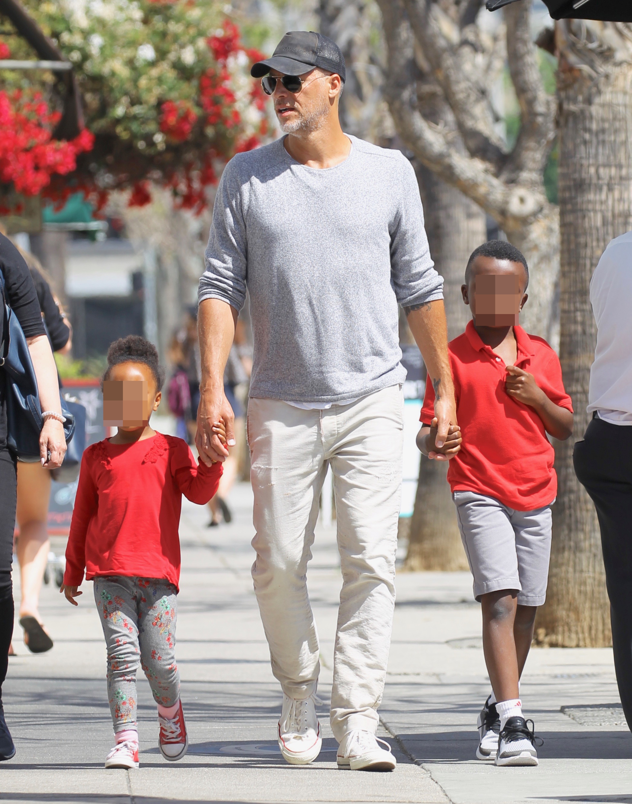 Bryan Randall takes Sandra Bullock's kids, Louis (right) and Layla (left) on a walk in Studio City on May 10, 2018
