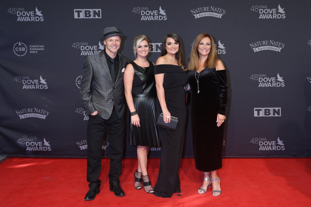 The Nelons, including Kelly Nelon Clark, posing on the red carpet at the 48th Annual GMA Dove Awards in Nashville, TN.