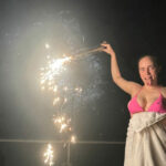 Billie Eilish shared a rare snap in a bikini top as she held a firework on July 4