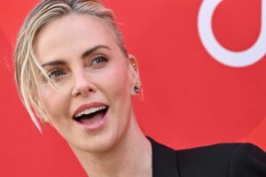 Charlize Theron attends the Charlize Theron Africa Outreach Project's 2024 Block Party on Saturday, July 13. During the event, she told E! News about the challenge of raising two girls.