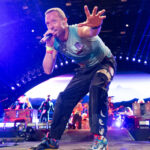 Coldplay, fronted by Chris Martin, have settled their High Court battle with ex-manager Dave Holmes