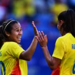 Colombia's midfielder #10 Leicy Santos  (L)  celebrates with  Colombia's midfielder #08 Marcela Restrepo after scoring her team's second goal during the women's group A football match between New Zealand and Colombia of the Paris 2024 Olympic Games at the Lyon Stadium in Lyon on July 28, 2024. (Photo by Olivier CHASSIGNOLE / AFP) (Photo by OLIVIER CHASSIGNOLE/AFP via Getty Images)