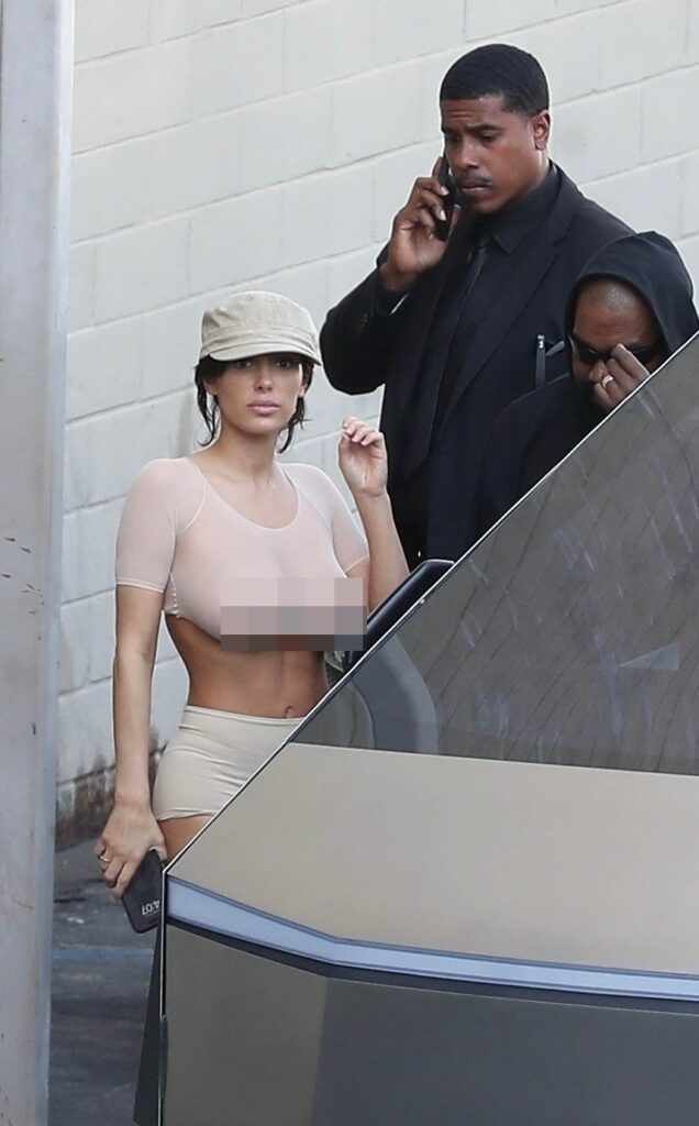 Bianca Censori wearing a see-through top after leaving a movie theater with her husband Kanye West