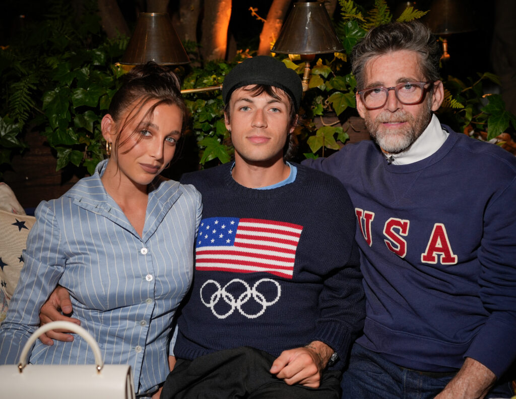 Emma Chamberlain, Peter McPoland and Emma's father Mike Chamberlain, pictured at An Evening at Ralph’s held at Ralph’s Restaurant on July 27, 2024 in Paris, France, wore matching outfits