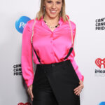 Jodie Sweetin, seen in a hot pink top at a taping of P&G & iHeartMedia’s Can’t Cancel Pride 2024 event in May 2024, defended the Olympic opening ceremony
