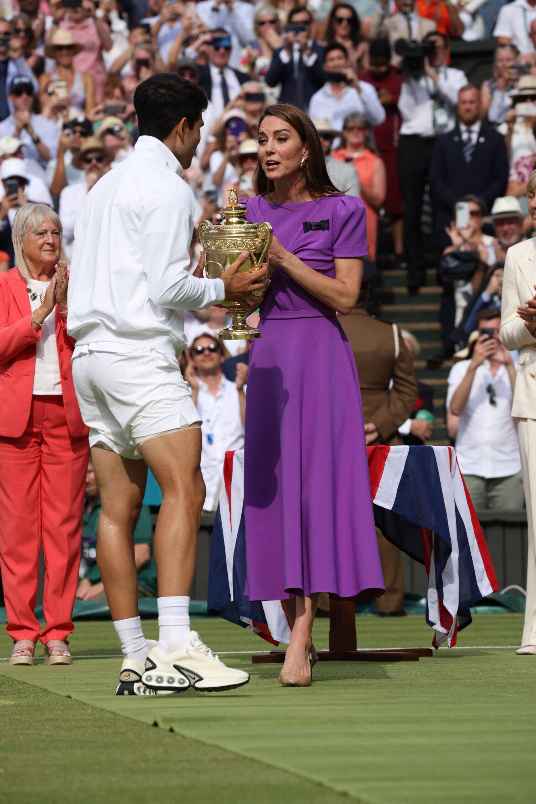 Catherine, Princess of Wales (Kate Middleton), Patron of The AELTC, presents the Gentlemen's Singles Trophy to Carlos Alcaraz of Spain following his victory at the 2024 Wimbledon men's final