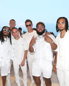 Tom Brady (center) was among the guests at Michael Rubin's exclusive White Party on July 4