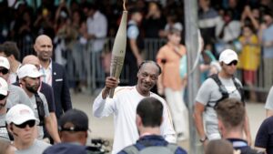 Snoop Dogg Is All Smiles Carrying the Olympic Torch: Photos