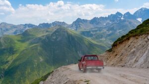 car flies off mountain