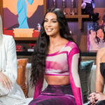 Kardashian sisters Khloé, Kim, and Kourtney smiling during Watch What Happens Live in 2019
