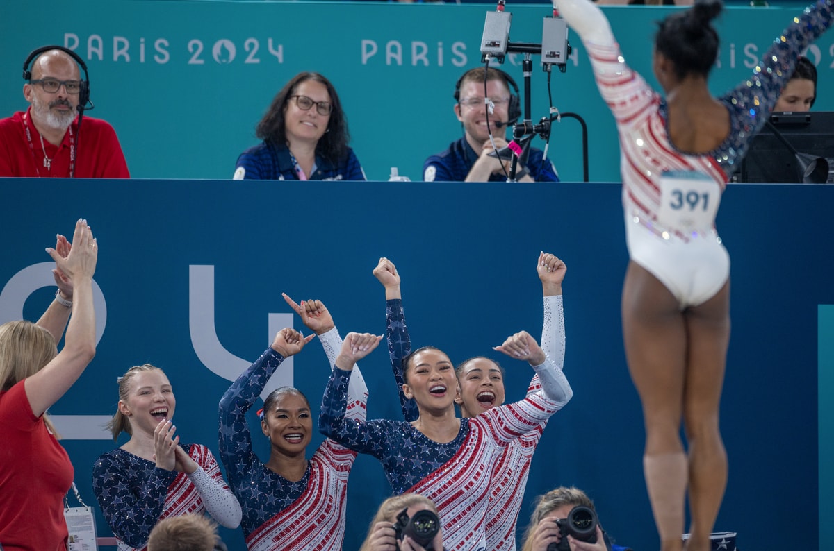  United States team members Jade Carey, Jordan Chiles, Sunisa Lee and Hezly Rivera react as Simone Biles finishes her floor routine to clinch the gold medal for the United States during the Artistic Gymnastics Team Final for Women at the Bercy Arena during the Paris 2024 Summer Olympic Games on July 30th, 2024 in Paris, France. (Photo by Tim Clayton/Corbis via Getty Images)