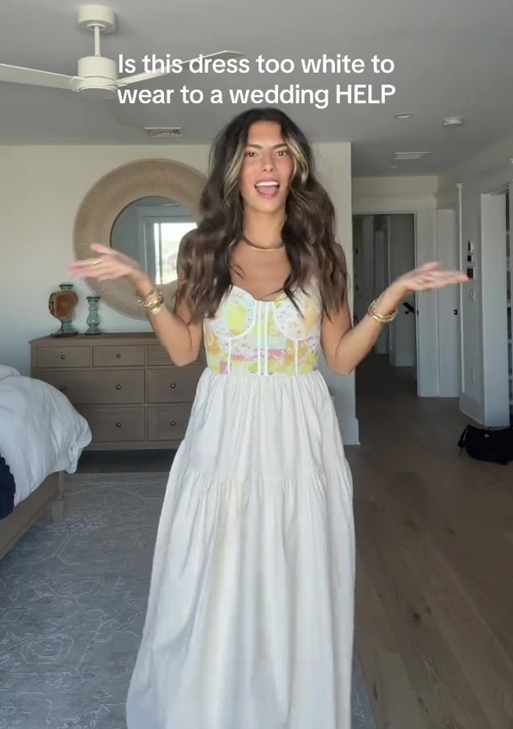 An influencer has caused a stir online after showing off the dress she plans to wear to an upcoming wedding