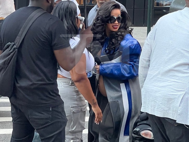 Cardi B Covered Up by Team Walking Through NYC