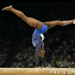 US' Simone Biles competes in the balance beam event of the artistic gymnastics women's all around final during the Paris 2024 Olympic Games at the Bercy Arena in Paris, on August 1, 2024. (Photo by Lionel BONAVENTURE / AFP) (Photo by LIONEL BONAVENTURE/AFP via Getty Images)