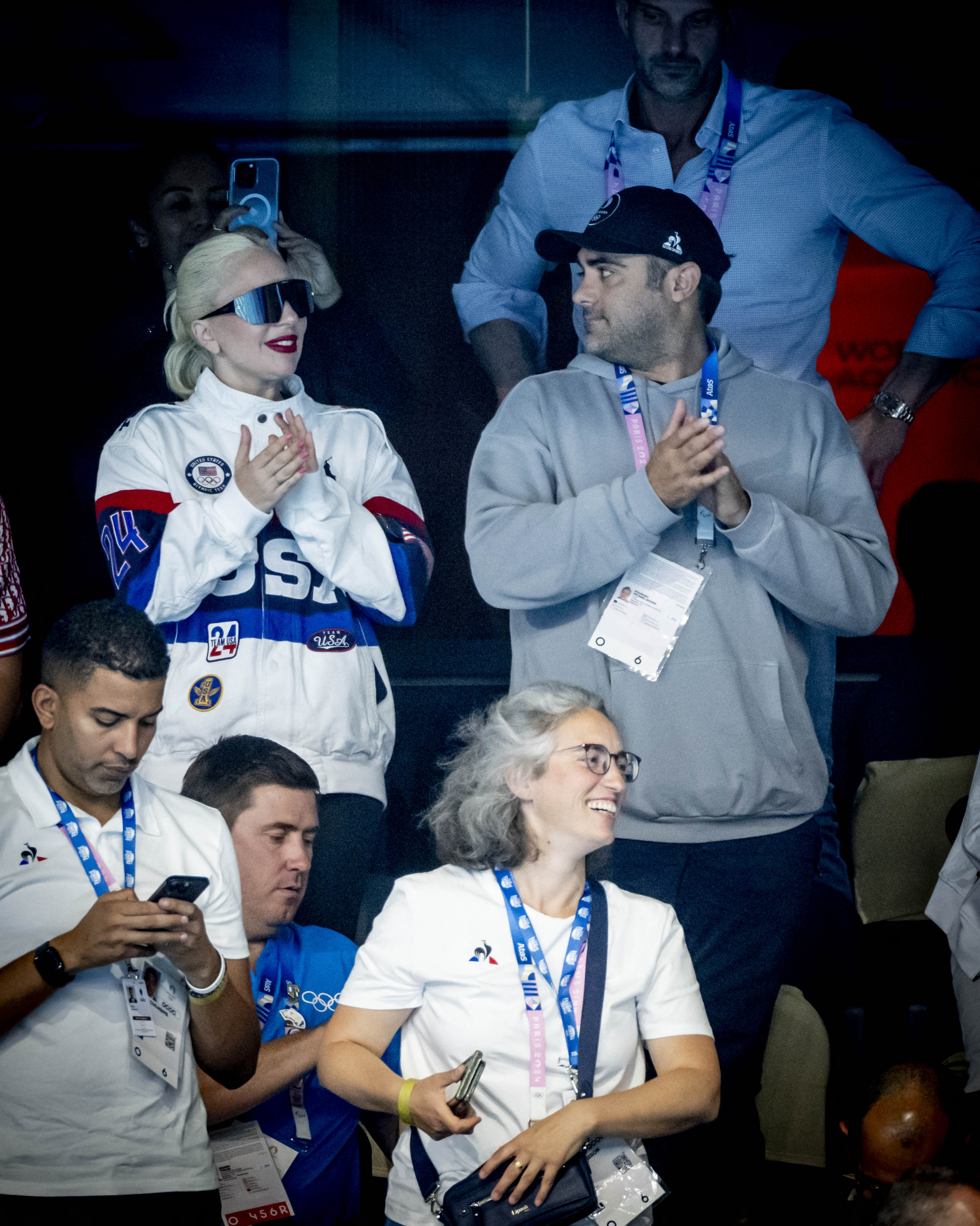 Michael Polansky looked at a happy Lady Gaga as they watch a swimming event during the Paris 2024 Olympic Games at the Paris La Defense Arena on July 28, 2024