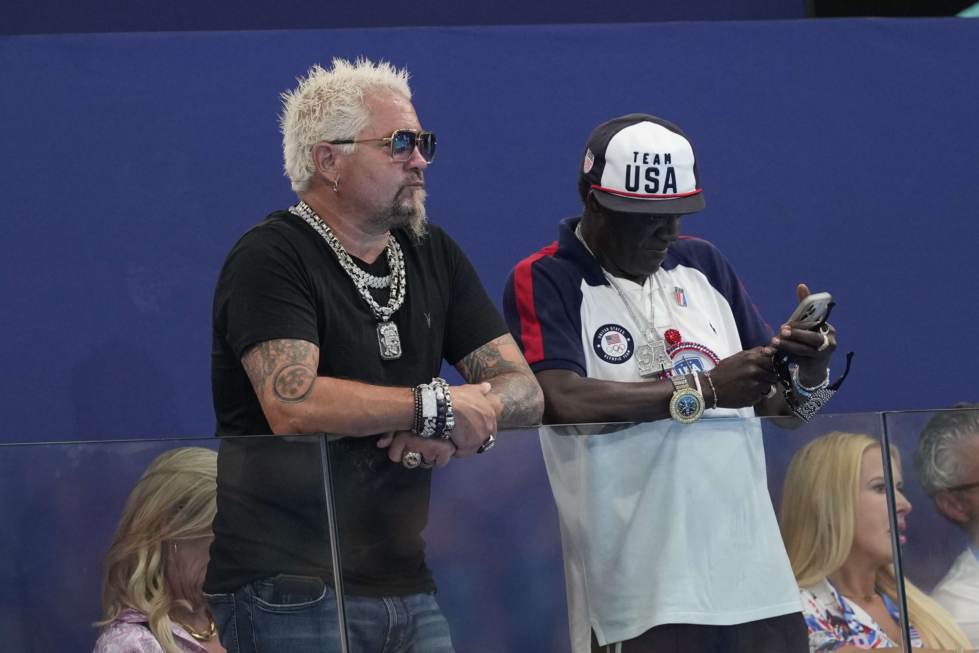 Guy Fieri and Flavor Flav at the women’s water polo Group B preliminary match between the United States and France